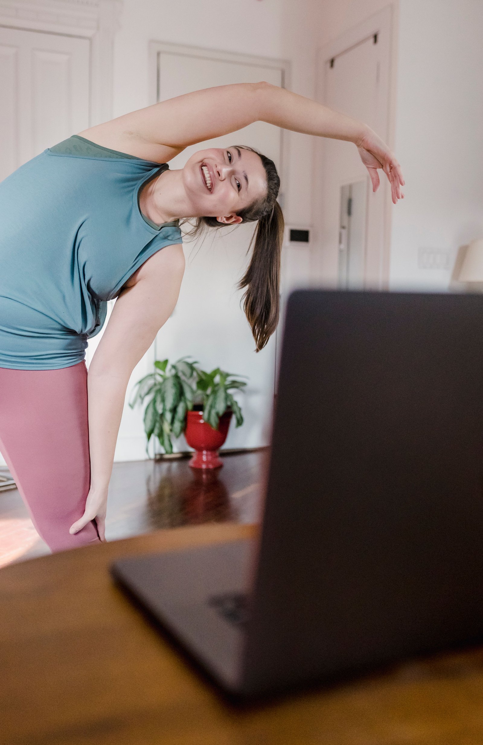 Student stretching during a live online yoga session