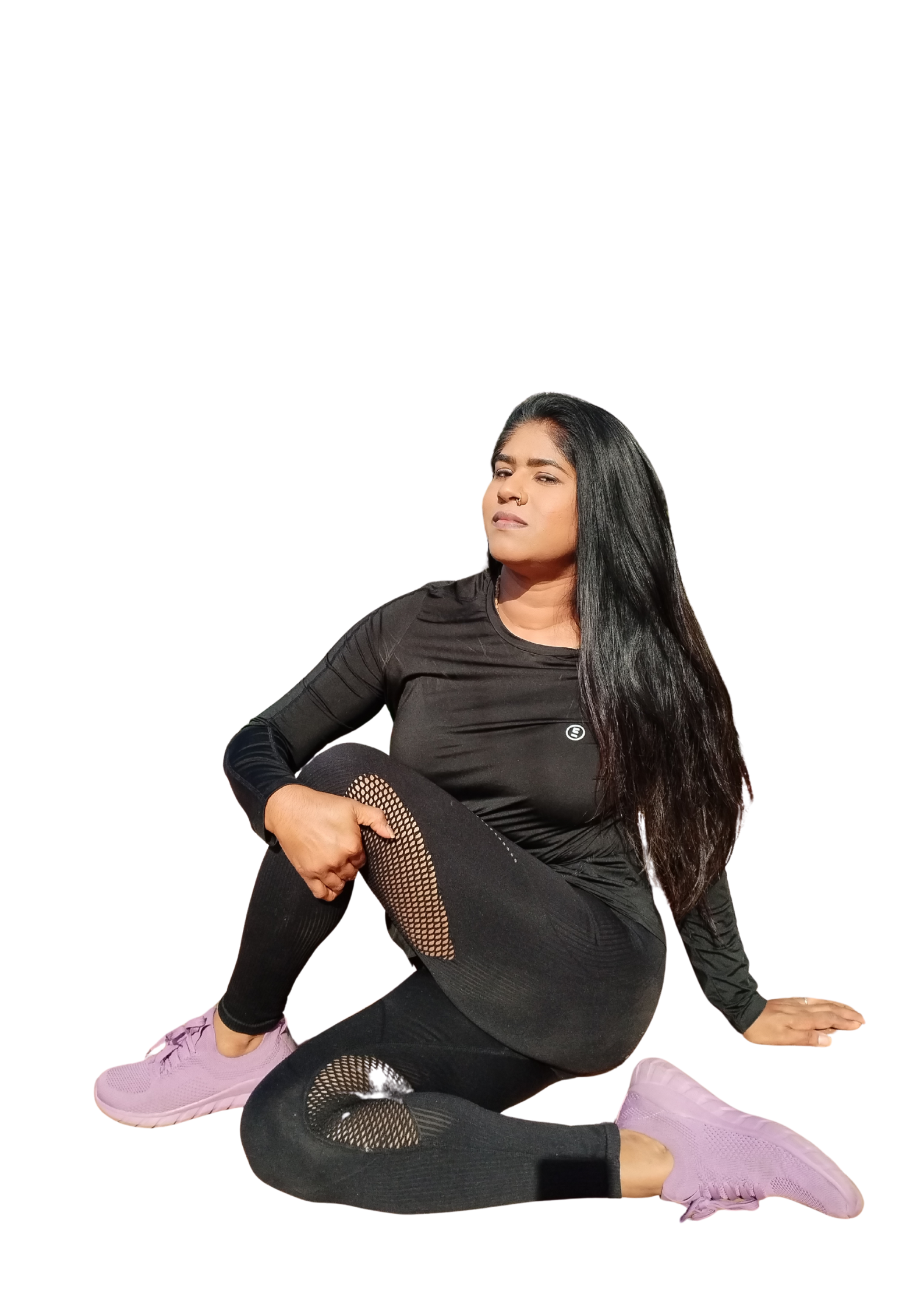 Yoga teacher stretching in a seated twist